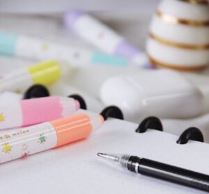 Vibrant stationery on an open notebook, ideal for study or office use.