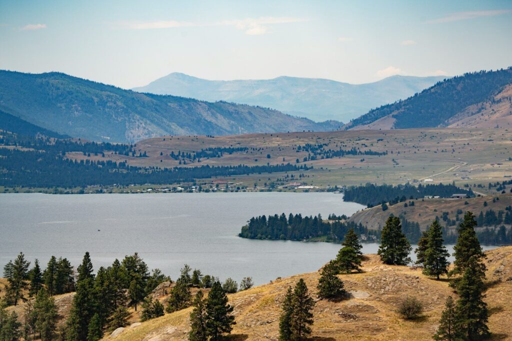 Flathead Lake, Montana; A scenic view of a lake surrounded by mountains