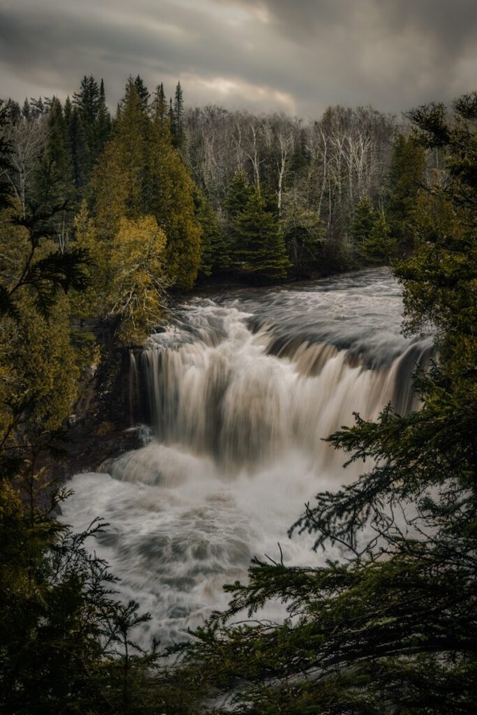 best state parks; waterfalls in forest during daytime