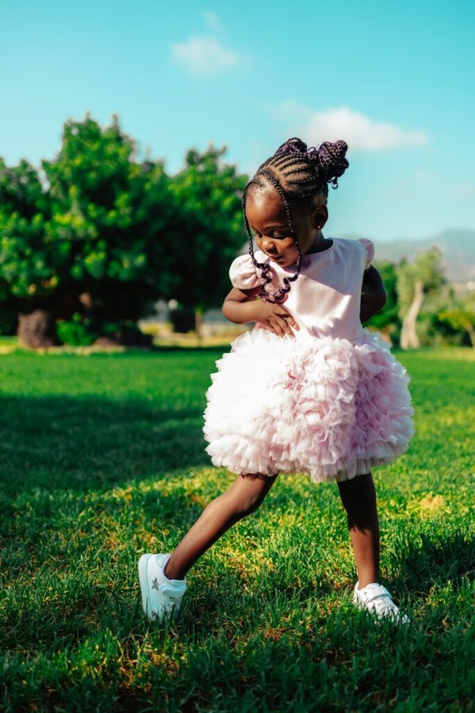 music and movement; A little girl in a pink tutu skirt